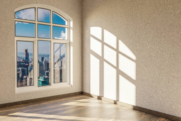 istock empty urban appartment with skyline view and brigth sunlight trough arched window; modern architecture design; 3D Illustration 1490300805