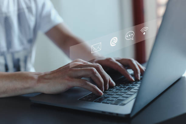 istock Contact us or Customer support hotline people connect. Businessman using a laptop and touching on virtual screen contact icons ( email, address, live chat, internet wifi ). 1490300925