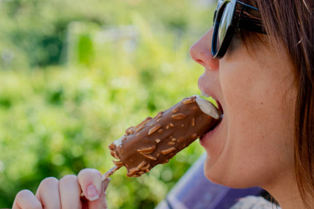 istock Ice cream. Woman eats ice cream. Close-up. 1490302221