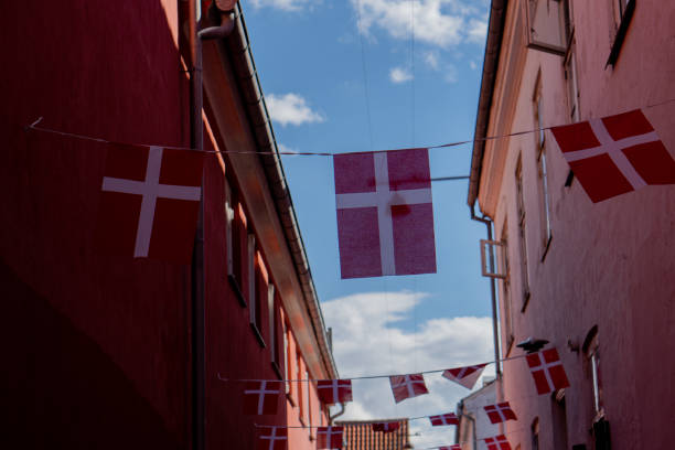 istock Flag. Flag of Denmark. Ancient street. 1490302923