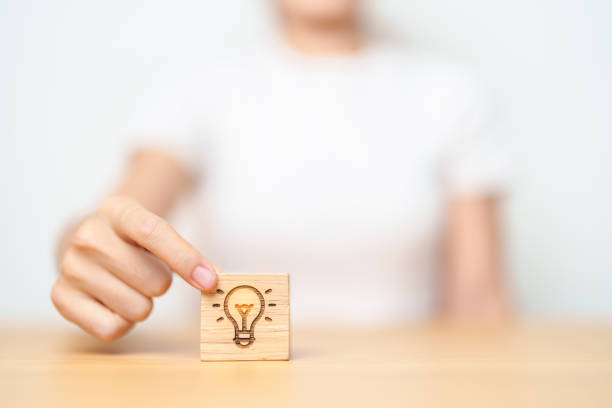 istock hand hold lightbulb  block with business Idea, strategy, innovation , creativity, learning, brainstorming  and success concept 1490304553