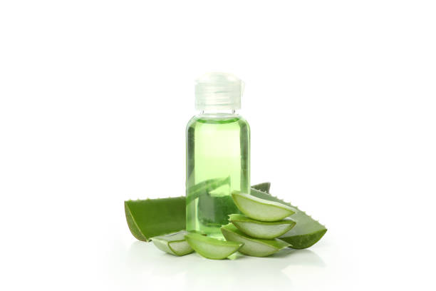 istock Aloe slices and bottle with gel isolated on white background 1490304952