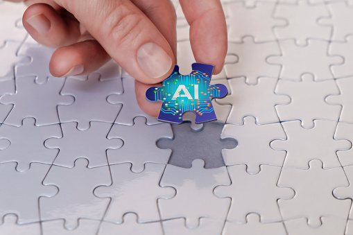 The businesswoman places the last piece of the puzzle, the concept of artificial intelligence.