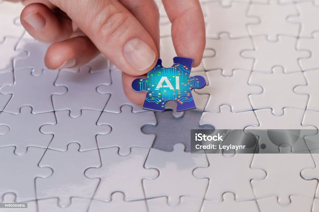 Artificial intelligence concept The businesswoman places the last piece of the puzzle, the concept of artificial intelligence. Artificial Intelligence Stock Photo