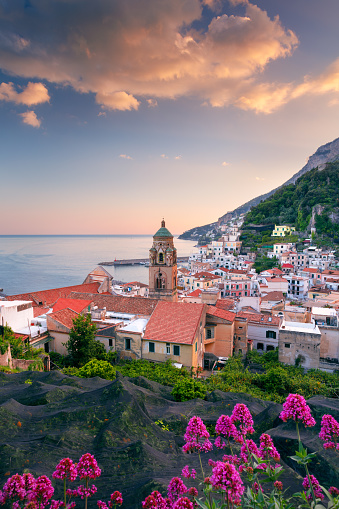 Cityscape image of famous coastal city Amalfi, located on Amalfi Coast, Italy at sunset.