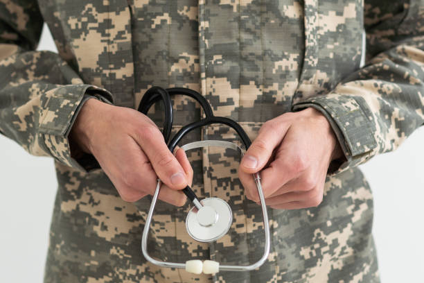 istock Young man army soldier holding stethoscope. 1490306892