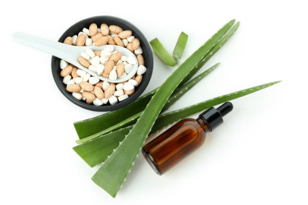 istock Concept of herb pills with aloe isolated on white background 1490308433