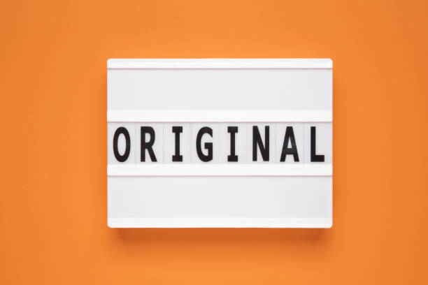 istock The word original on lightbox isolated orange background. Info concept 1490315735