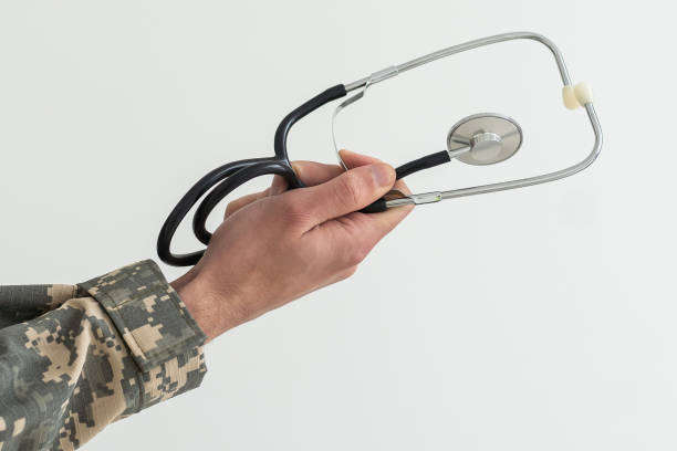 istock Young man army soldier holding stethoscope. 1490316042