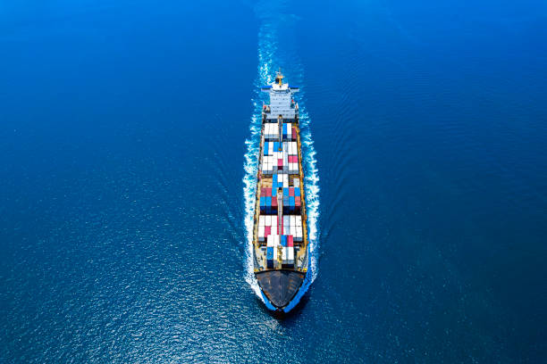 istock Aerial view Top speed with beautiful wave of container ship full load container with crane loading container for logistics. 1490316954