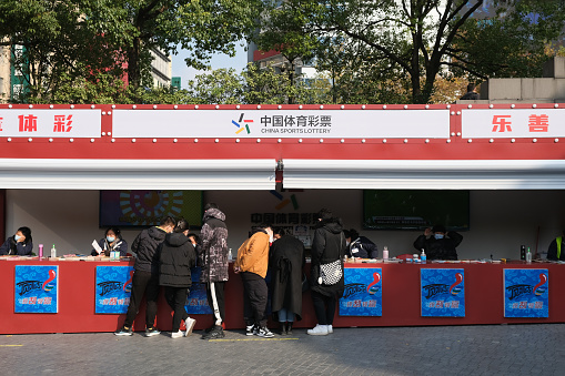 Shanghai,China-Dec.17th 2022: Chinese people buy lottery at China Sports Lottery store.