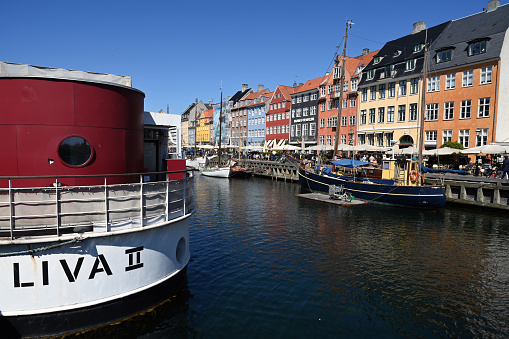 Copenhagen, Denmark, May 12, 2023 : Nyhavn canal with its colorful houses and boats