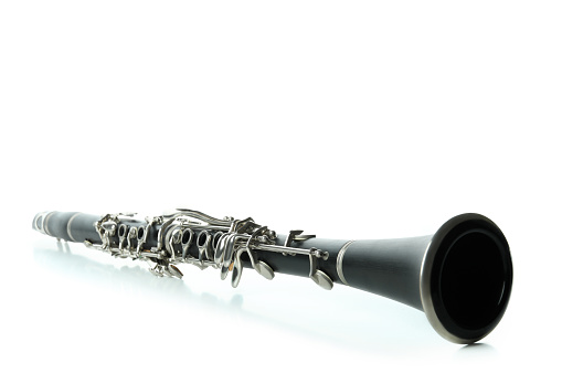 Silver classic flutes standing on gray background.