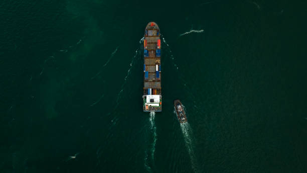 istock Container ship carrying container for import and export international in sea aerial top view photograph from drone 1490322510