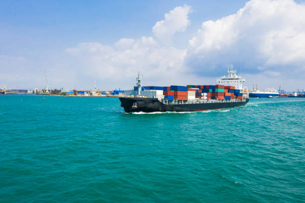 istock Container ship in export and import business and logistics. 1490322542