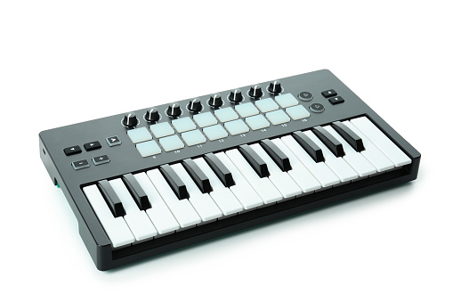 Midi keyboard digital instrument isolated on white background