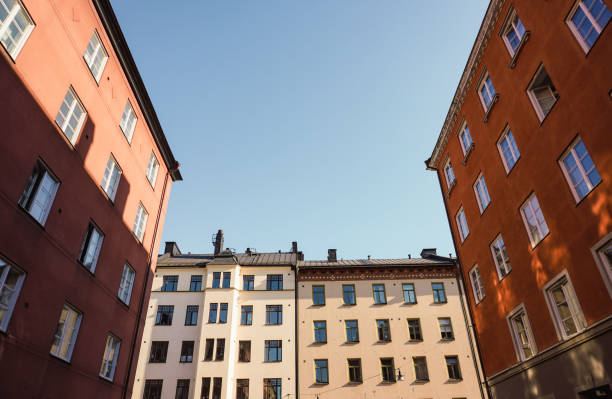 istock Low angle view of buildings against clear sky 1490325695