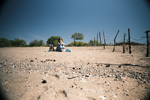 Woman is having a rest on the sand