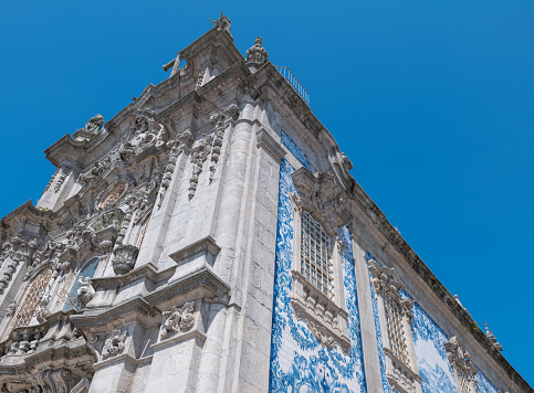 Porto, Portugal, upward view of  the Do Carmo church with  the  azulejos (traditional ceramic tiles painted in the typical blue color)