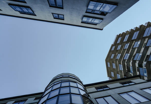 istock Low angle view of modern buildings against clear sky 1490328639