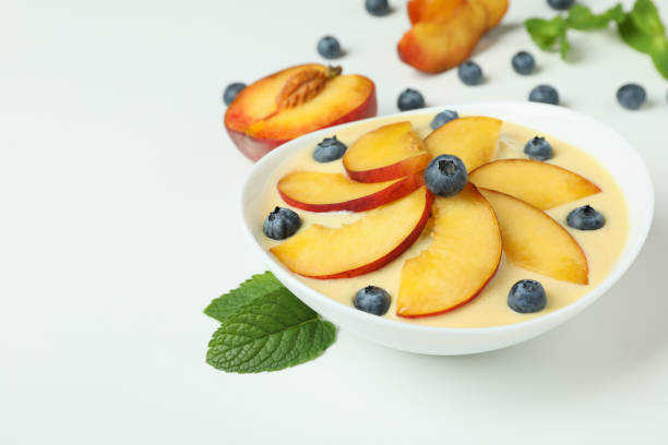 istock Peach yogurt and ingredients on white background 1490331067