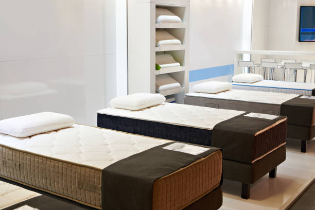 istock Modern bed with mattresses and pillows in store 1490332067