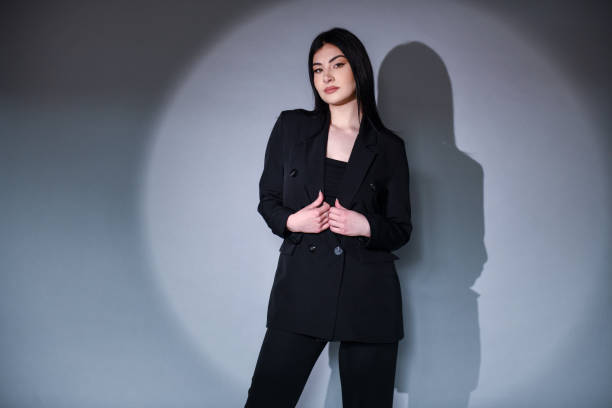 istock Gorgeous Female In Her New Suit On Background 1490332113