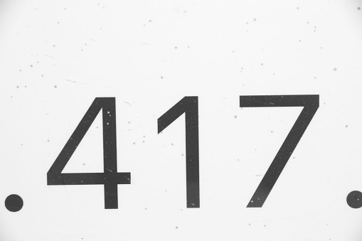 A closeup shot of a white 417 sign against the plain background.
