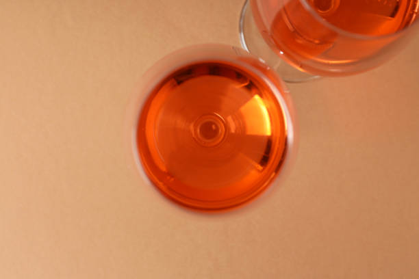 istock Glasses of wine on beige background, top view 1490336423