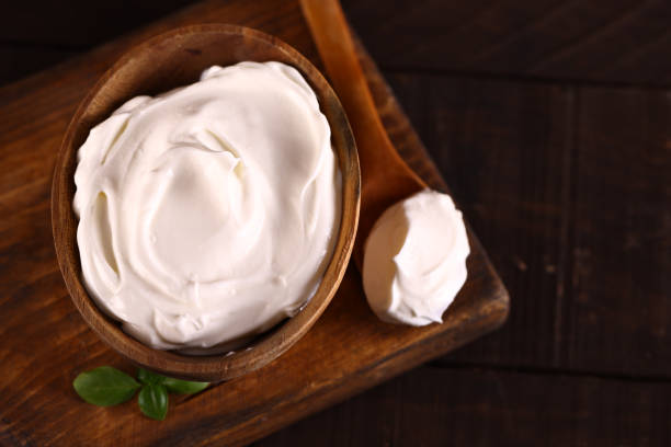 istock natural organic sour cream on wooden table 1490337225