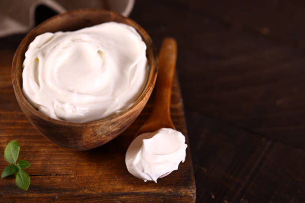 istock natural organic sour cream on wooden table 1490337236