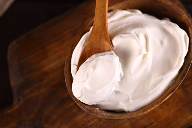istock natural organic sour cream on wooden table 1490337264