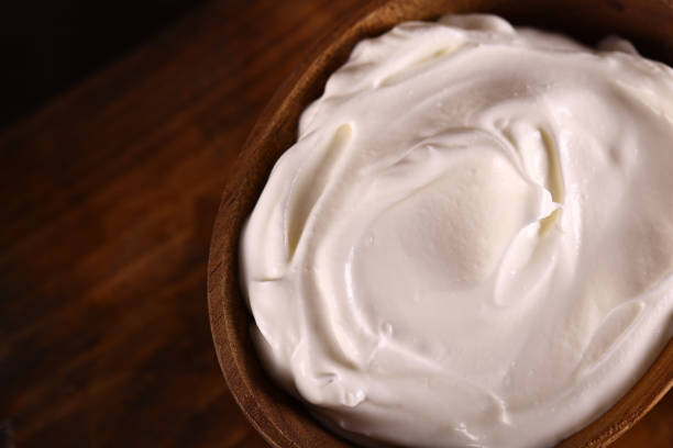 istock natural organic sour cream on wooden table 1490337272