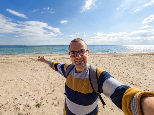 istock Young Man Taking A Selfie On The Beach In Greece 1490338058