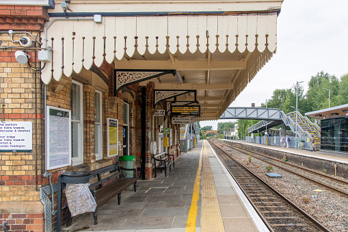 Moreton-in-Marsh, UK-August 2022: View over the platform of the railway station on the Cotswold Line and passenger trains operated by Great Western Railway