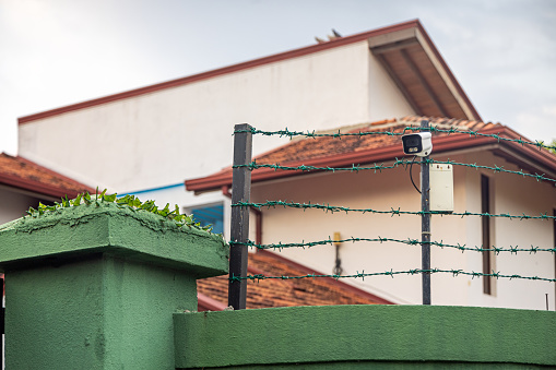 Residential house with barbed wire, glass shards and a surveillance camera in Negombo in Sri Lanka