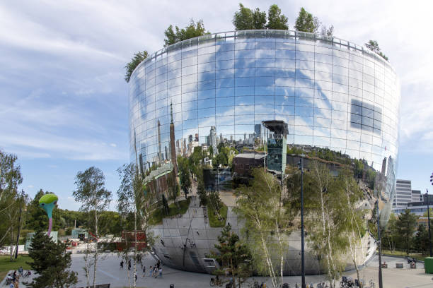 Rotterdam, The Netherlands-October 2022; Low angle view of The Depot Boijmans Van Beuningen with reflection of city in mirrors of this art storage facility