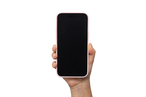 Mobile phone with black screen in female hand isolated on a white background. Blank with an empty copy space for the text. Template for the design. Mockup of a smartphone. Young woman takes picture