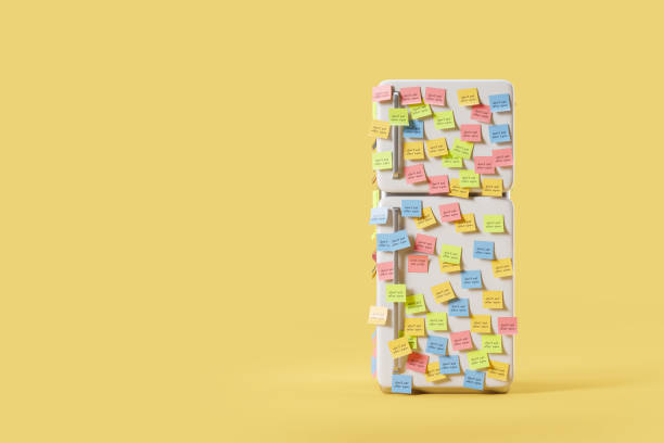 istock Cartoon fridge with sticker notes about diet on yellow background, copy space 1490348534
