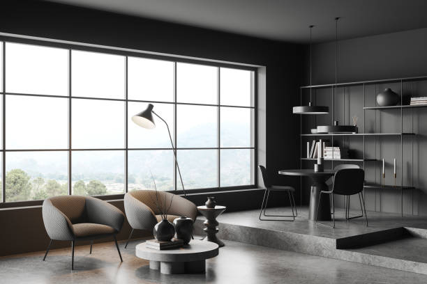 istock Grey relax room interior with armchairs and decor, dining corner and window 1490348807