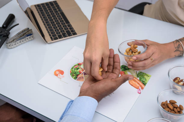 istock A woman's hands putting Nut's in a black man's hand 1490349919