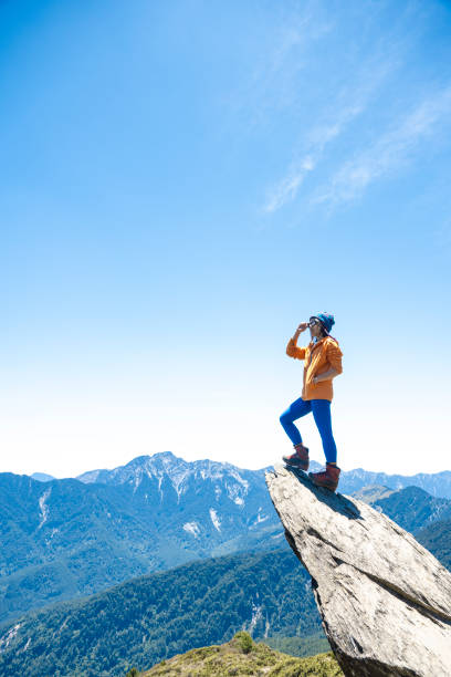 Hiker on the top of the mountain peak.
