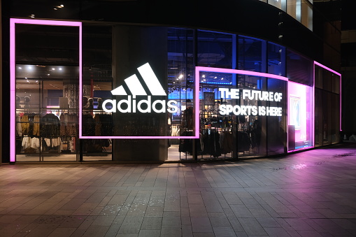 Shanghai,China-Dec. 18th 2022: adidas sports retail store at night.