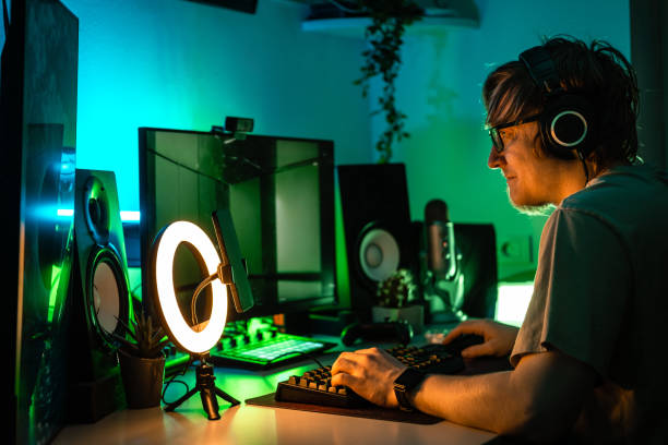 istock A man plays a video game on his gaming PC in green lit room. 1490353488