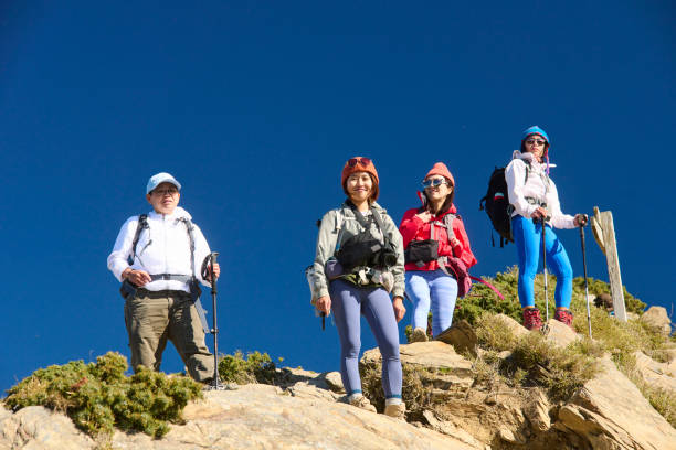 istock Good friends hiking together on the mountain. 1490353621