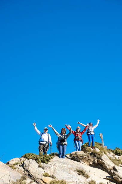Good friends hiking together on the mountain.