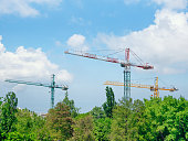 Construction crane or building crane on a construction site against blue sky