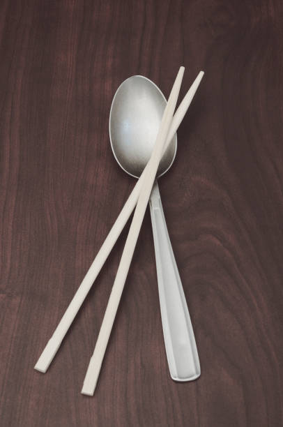 chopsticks and spoon stock photo