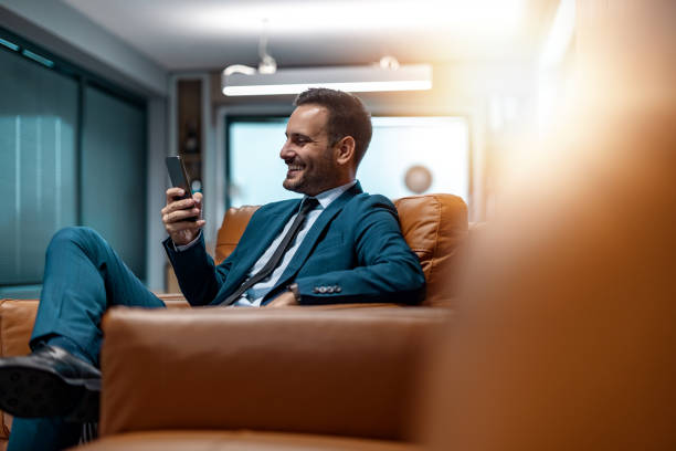 istock Businessman using mobile phone in his office 1490357333