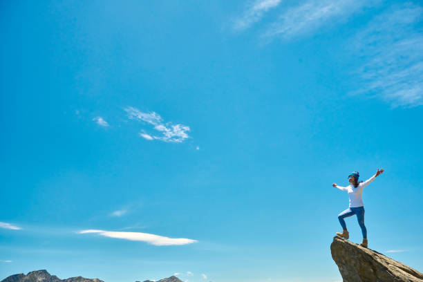 Hiker on the top of the mountain peak.